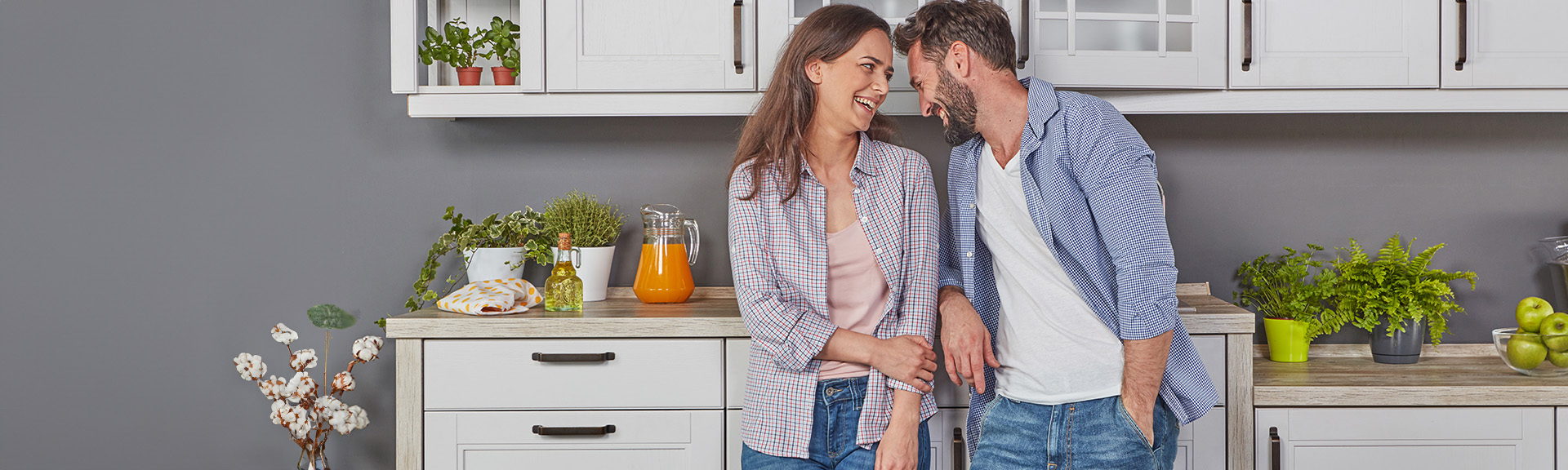 A couple in their kitchen